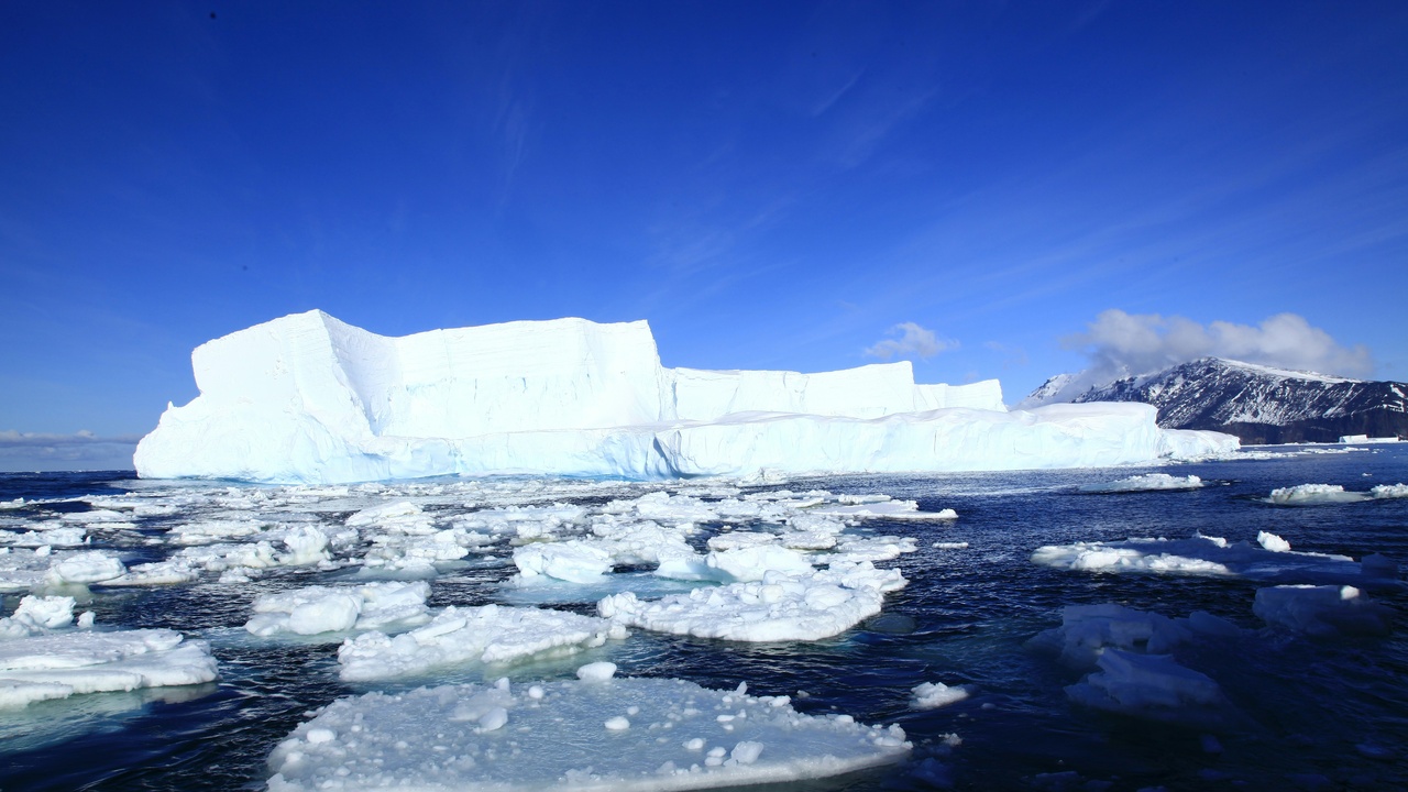 Retreating glacier and coastal shoreline illustrating sea level rise and ice loss