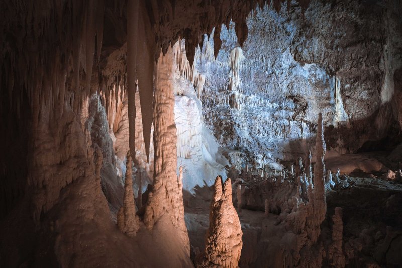 Explore intricate cave formations with stunning stalactites and natural textures.